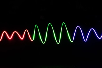 green light streaks on black background