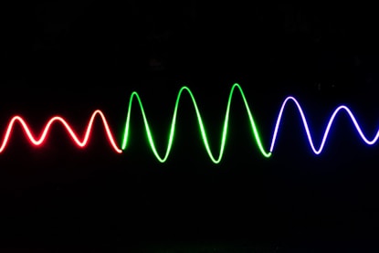 green light streaks on black background