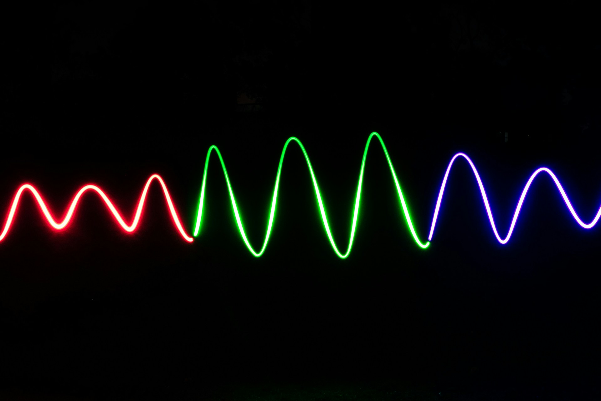 green light streaks on black background