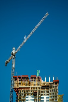 crane under blue sky during daytime