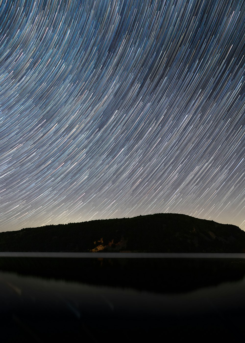 silhouette of mountain during night time