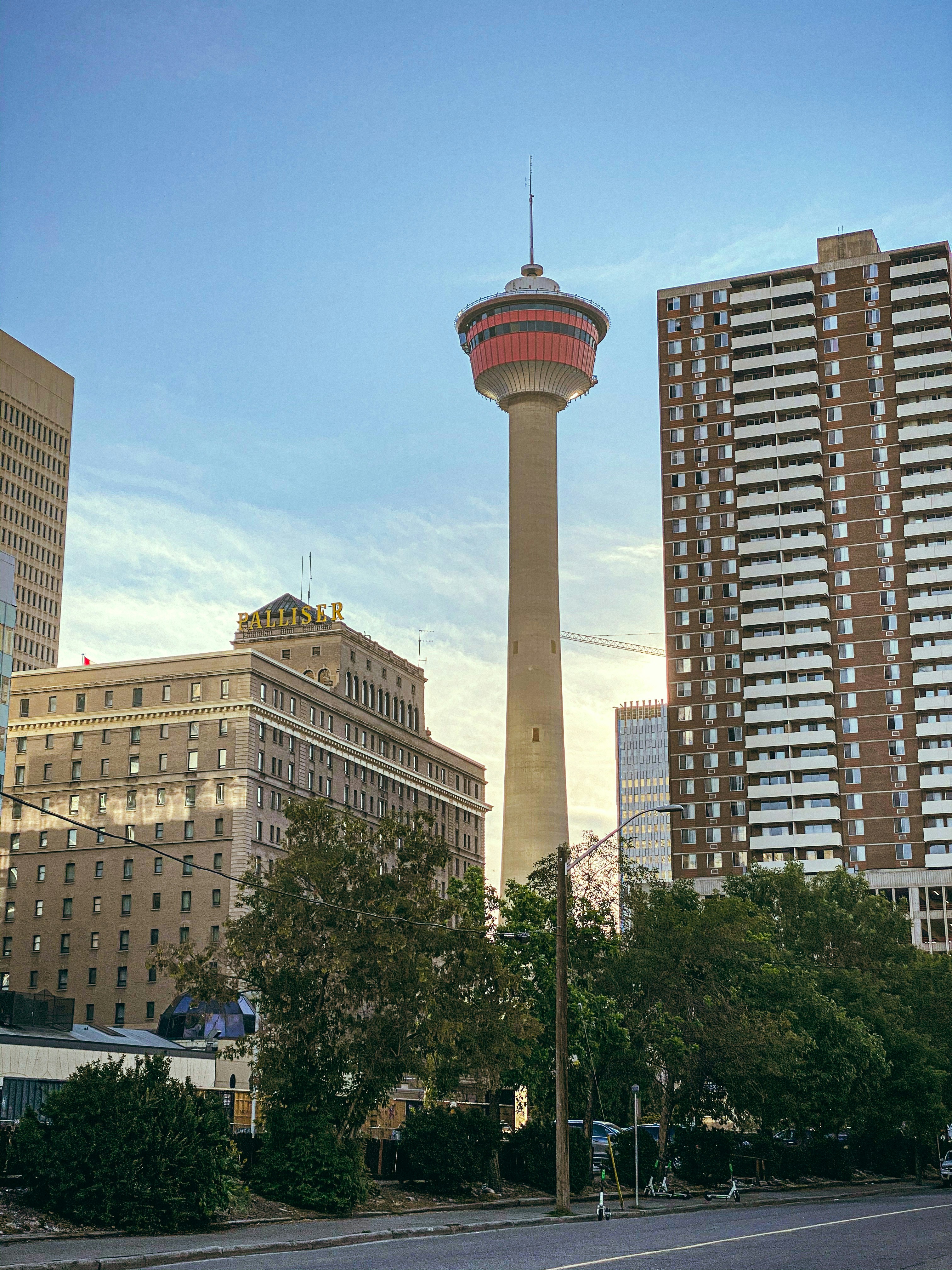 beige concrete building near green trees during daytime