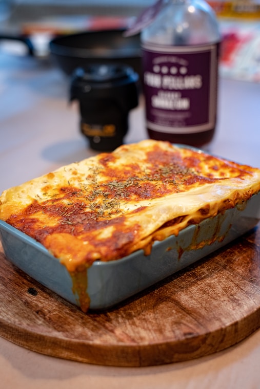Easy no-fail lasagna with layers of pasta, meat sauce, and melted cheese served in a baking dish