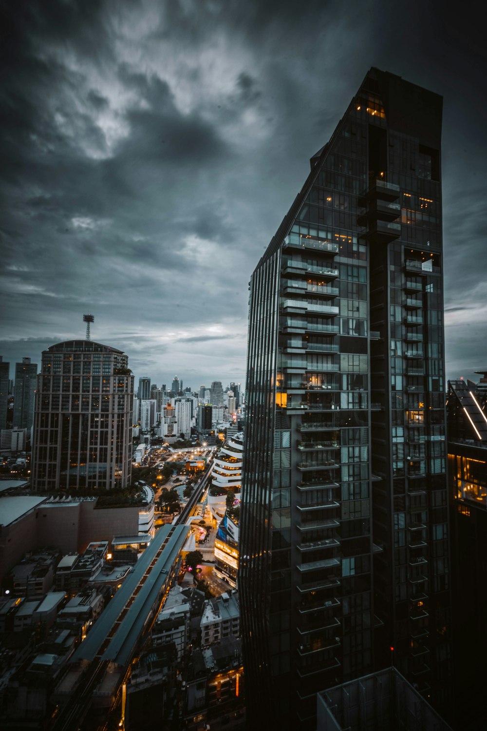 city buildings under gray cloudy sky during daytime