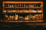 brown wooden shelf with bottles