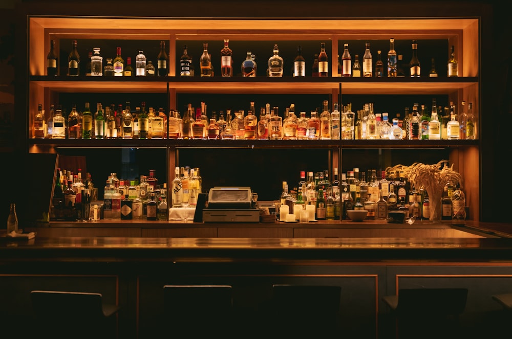 brown wooden shelf with bottles