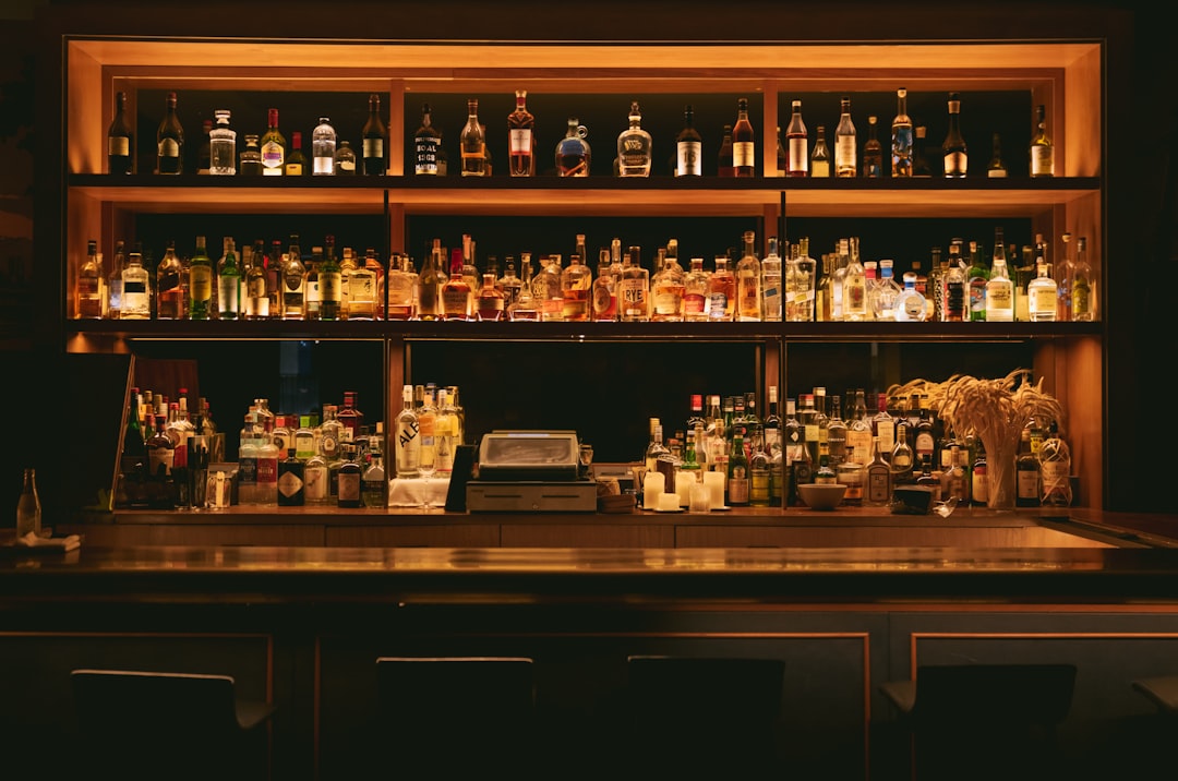 brown wooden shelf with bottles,