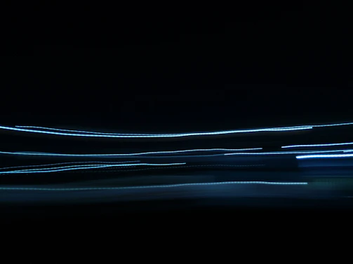 Abstract light trails symbolizing fast data flow and cutting-edge technology.