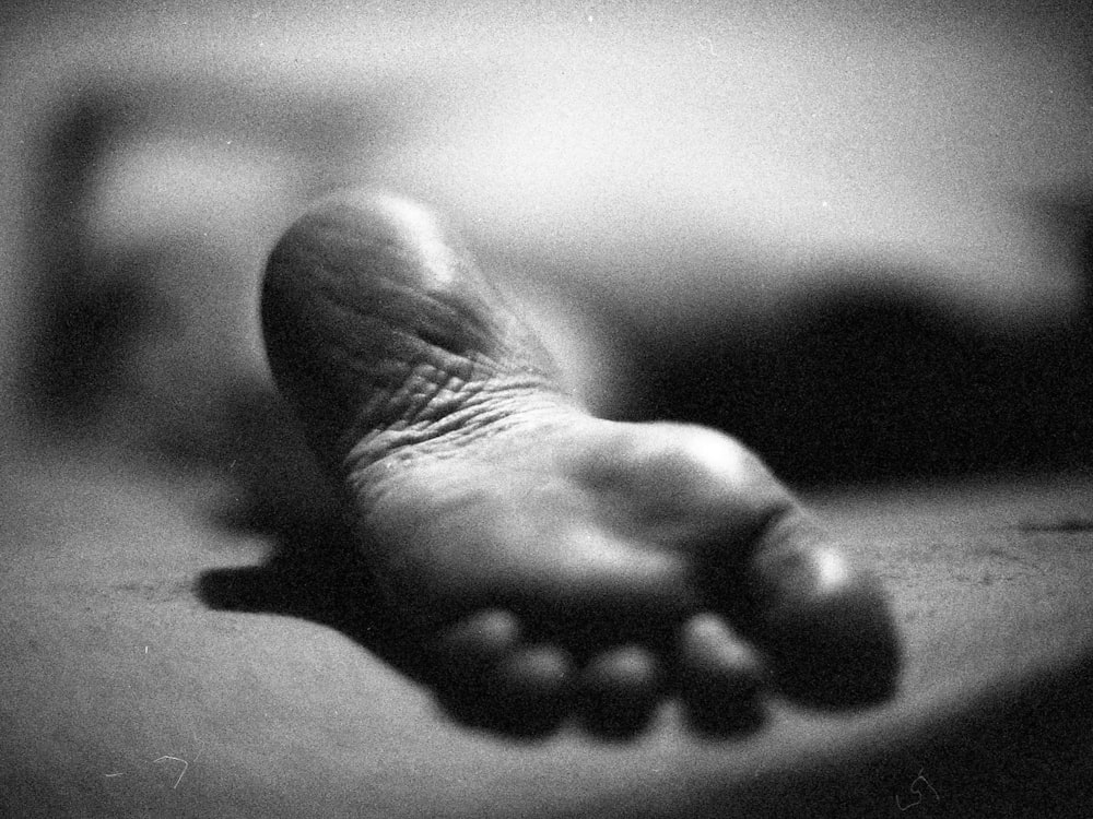 grayscale photo of persons right foot