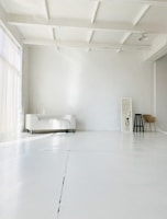 white bed near white wall