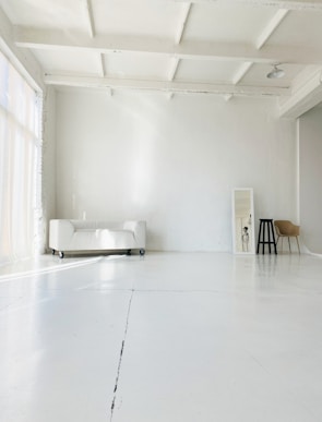 white bed near white wall