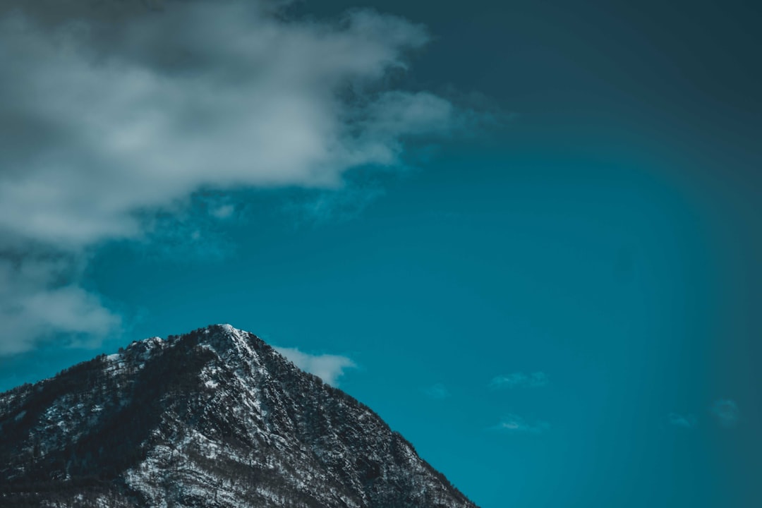 black and white mountain under blue sky