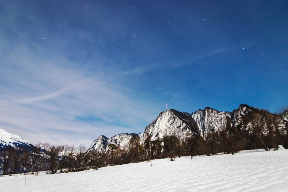 snow covered mountain under blue sky during daytime