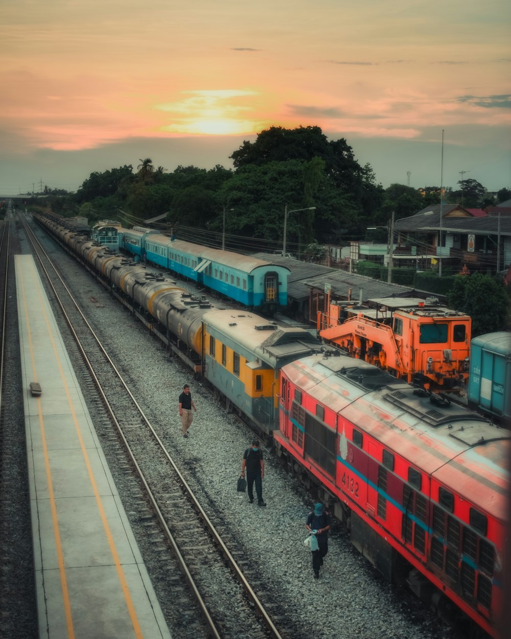 red and white train on rail during daytime