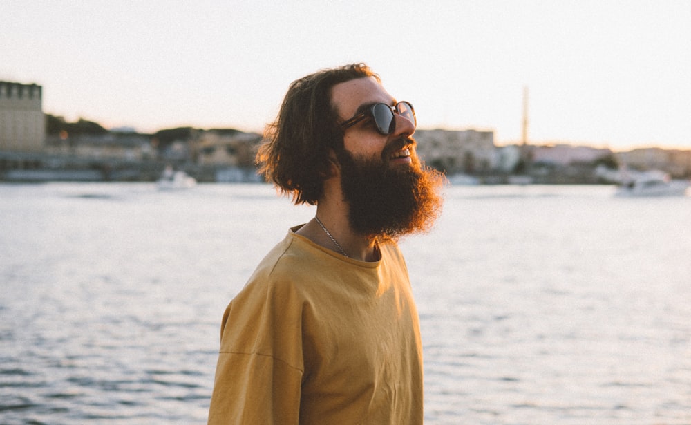 woman in brown crew neck shirt wearing black sunglasses