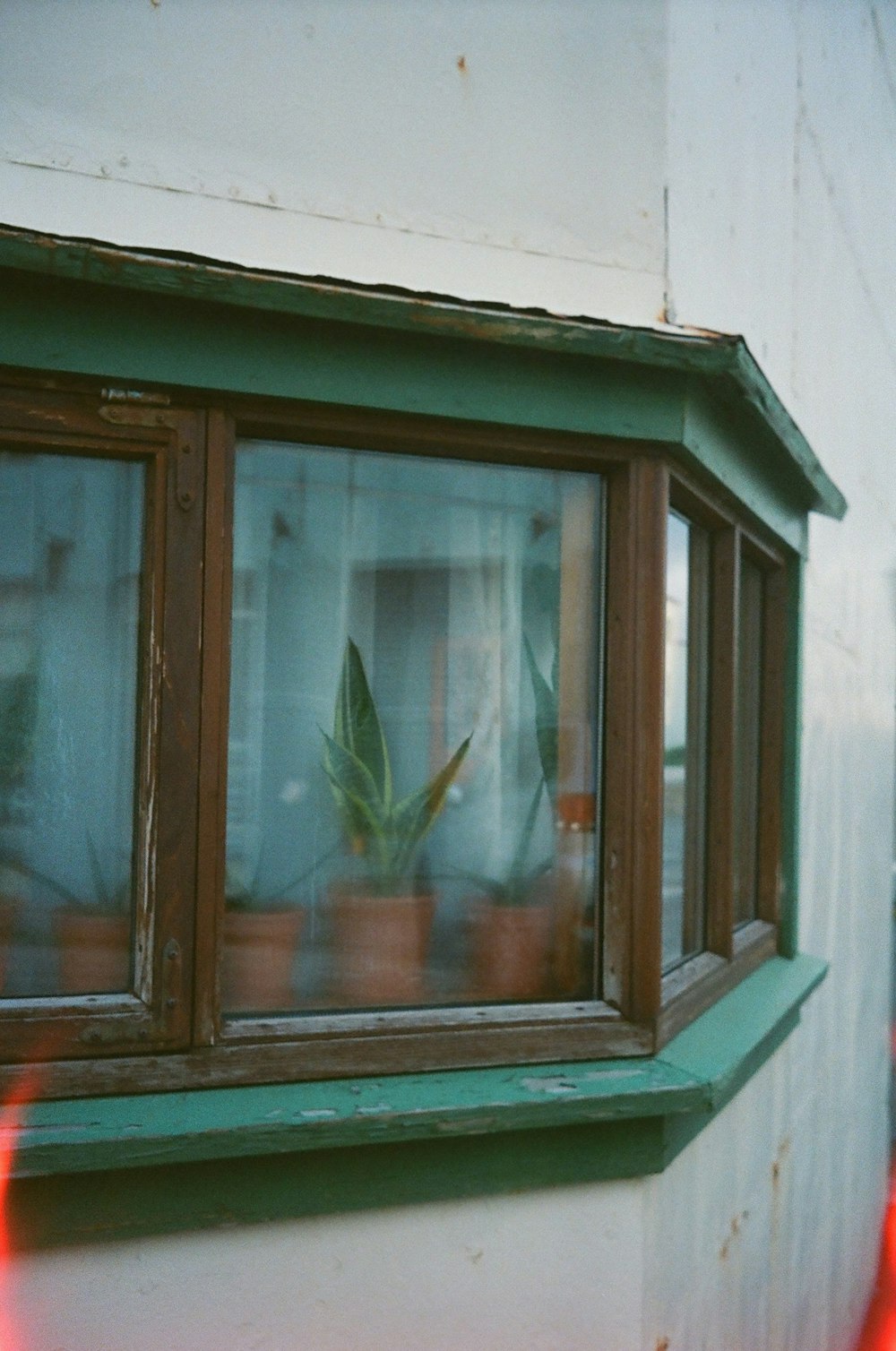 brown wooden framed glass window