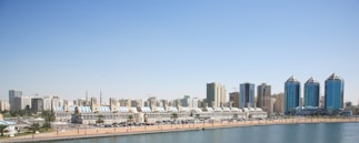 city buildings near body of water during daytime