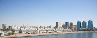 city buildings near body of water during daytime