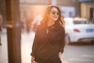 woman in black shirt wearing sunglasses
