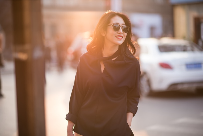 woman in black shirt wearing sunglasses