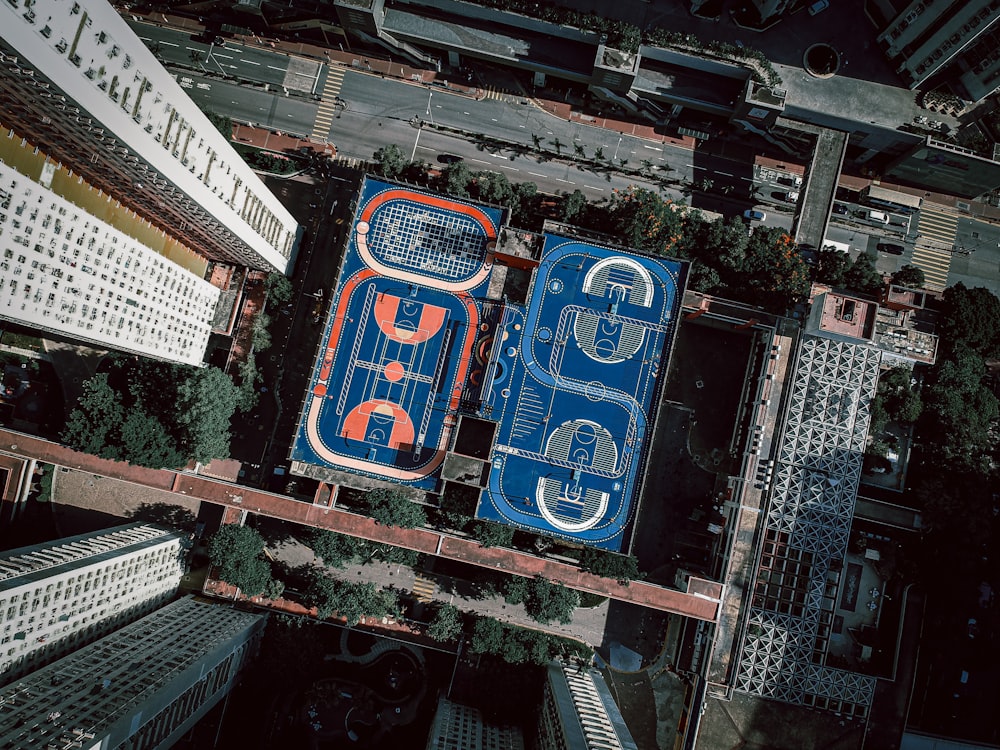 an aerial view of a basketball court in a city