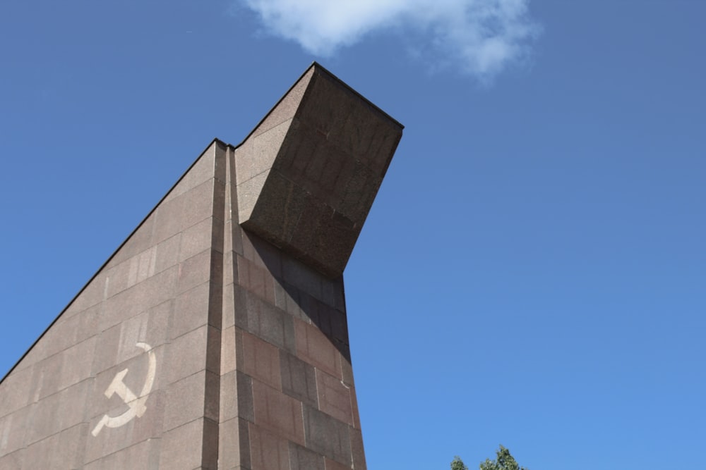 brown concrete building under blue sky during daytime