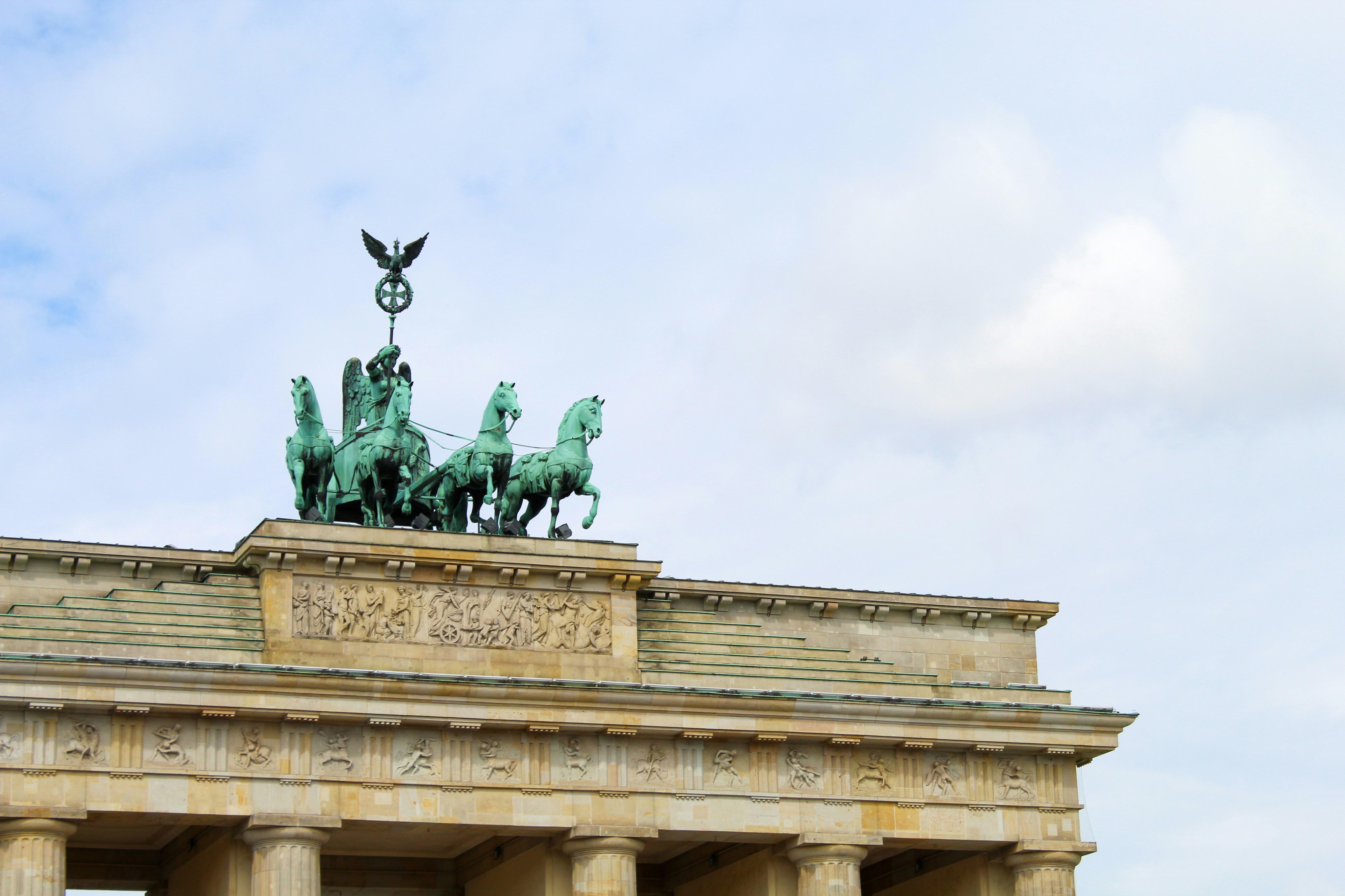 man riding horse statue under white sky during daytime, 