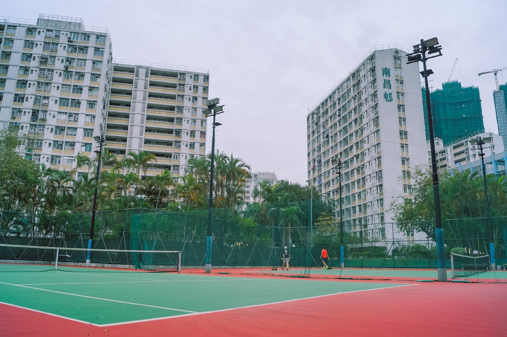basketball court in the middle of the city during daytime