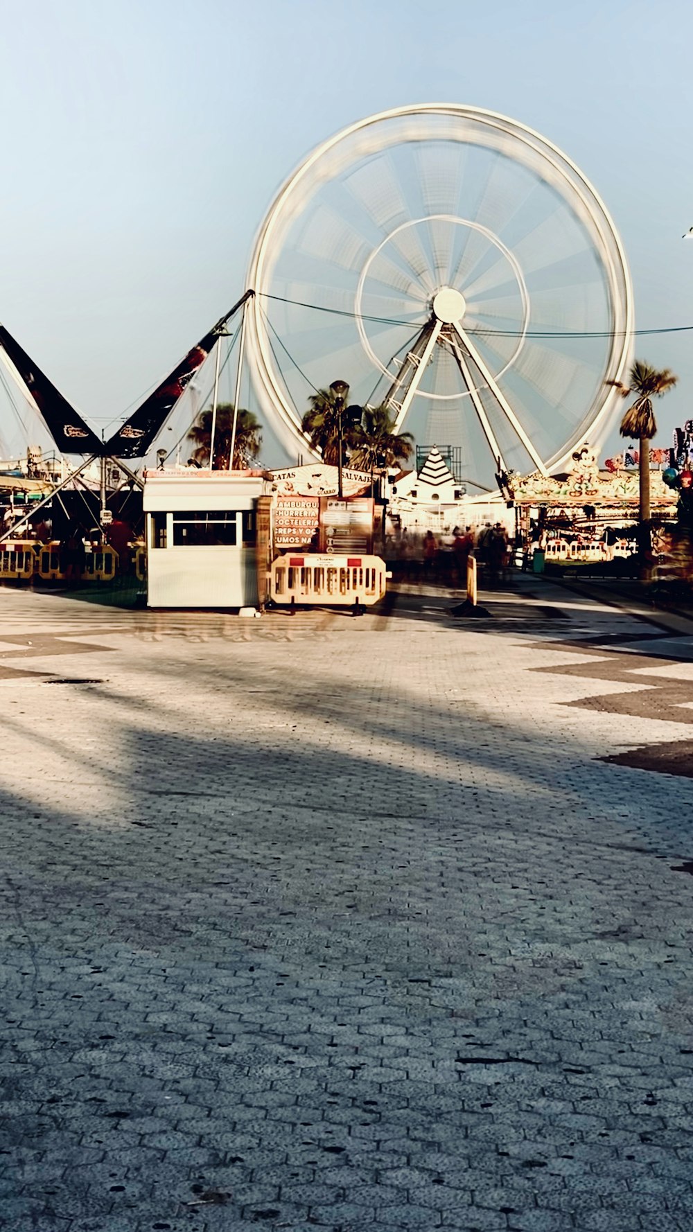 white and brown carousel under blue sky during daytime