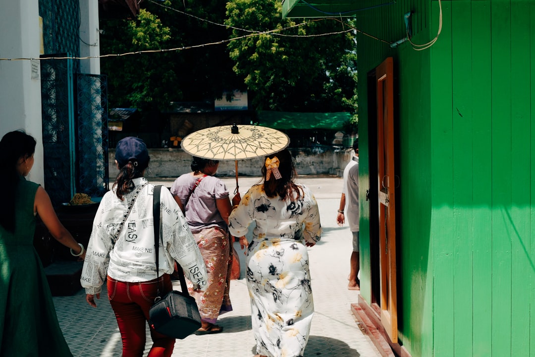 people walking on sidewalk during daytime