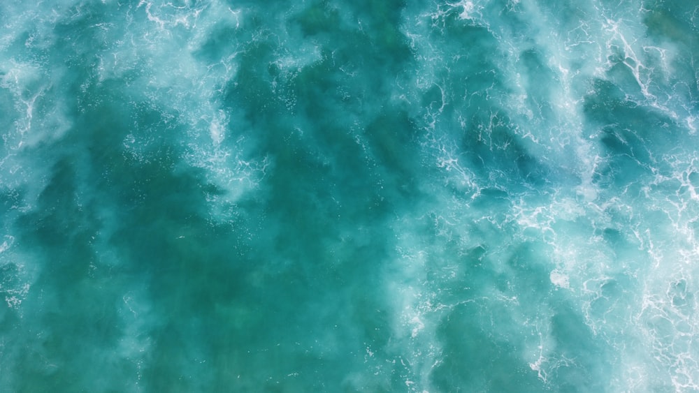 green and white water waves