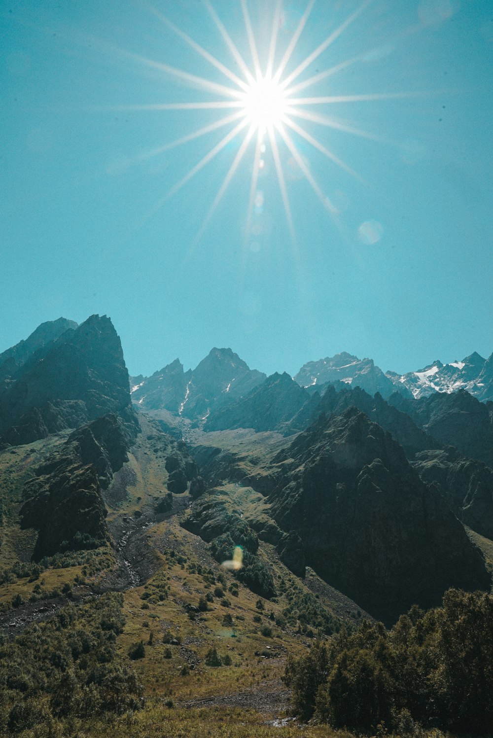 rocky mountain under blue sky during daytime