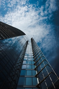 low angle photography of high rise building under blue sky