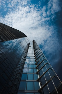 low angle photography of high rise building under blue sky