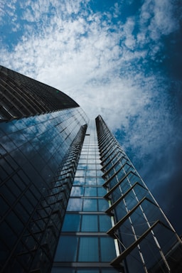 low angle photography of high rise building under blue sky