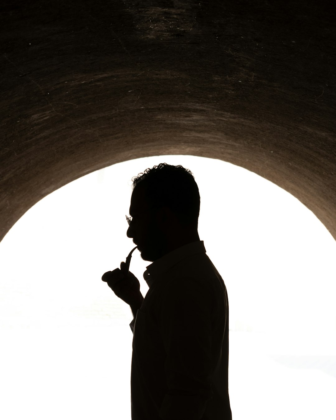 silhouette of man standing under tunnel during daytime photo – Free ... Silhouette Man Walking Tunnel