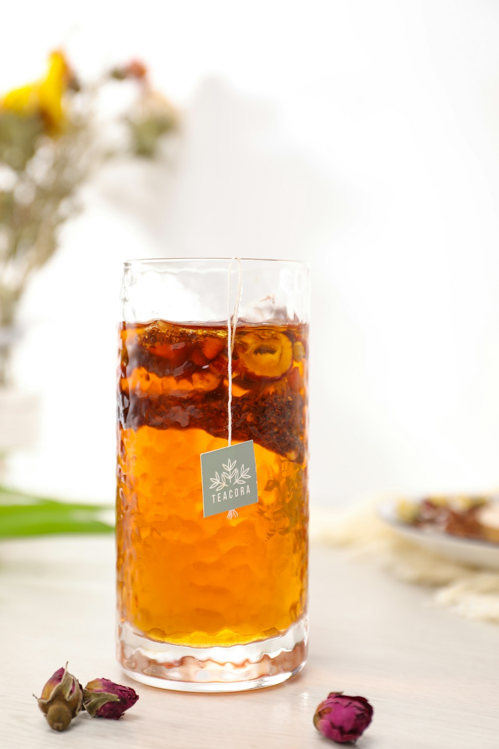 clear drinking glass with yellow liquid