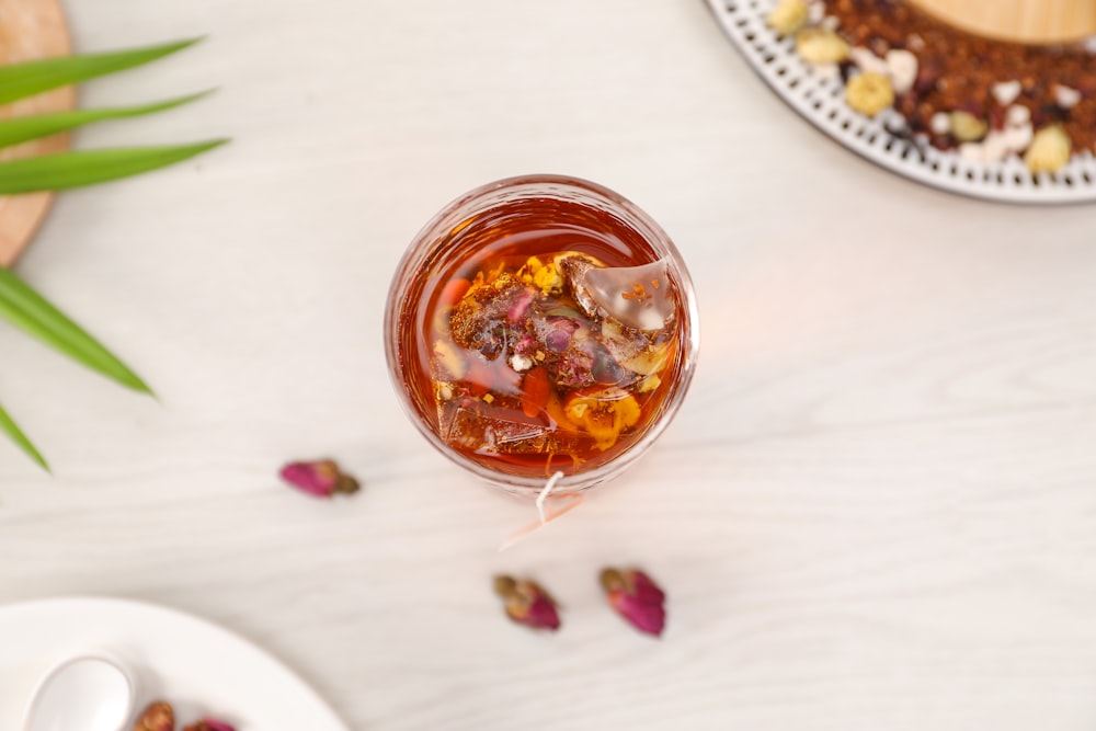 clear glass bowl with brown liquid