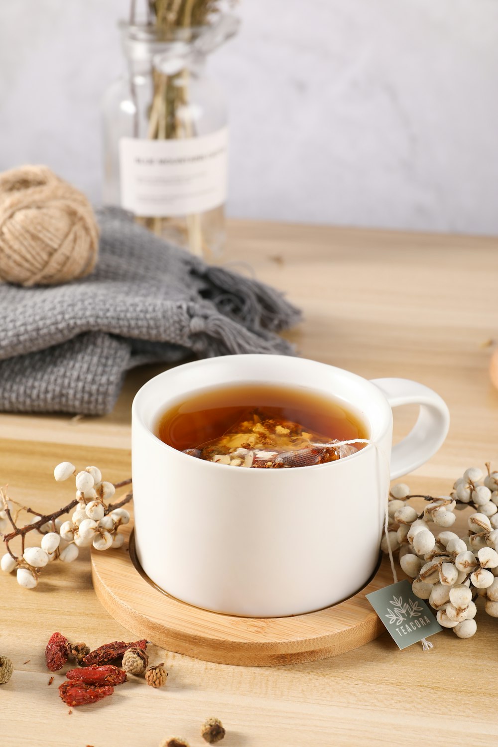 white ceramic mug with brown liquid inside