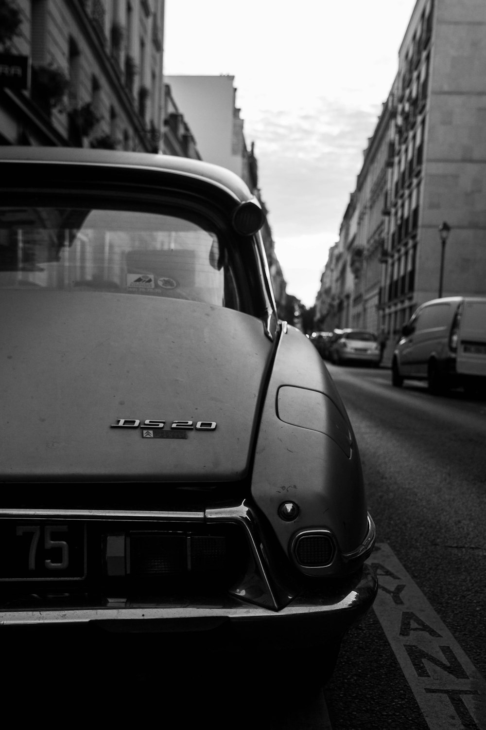 grayscale photo of car on road