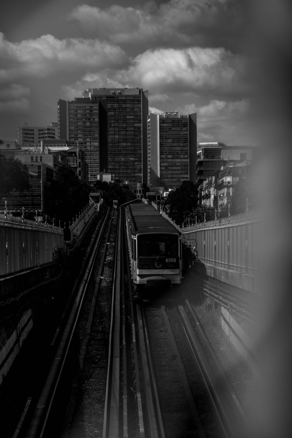 grayscale photo of city buildings