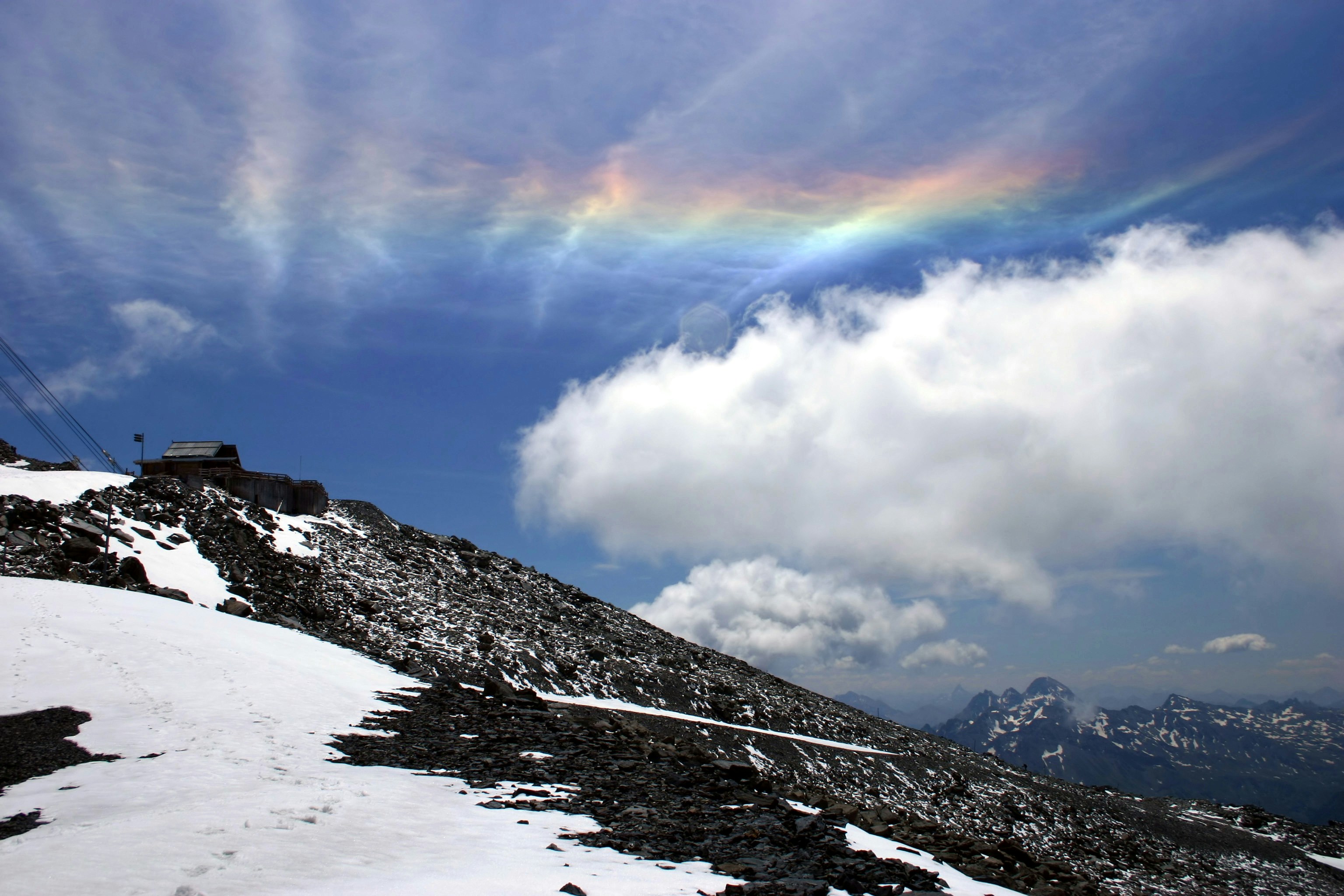 snow covered mountain under cloudy sky during daytime