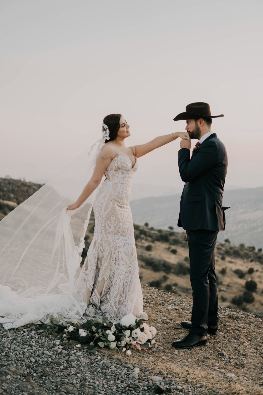 woman in white wedding dress and man in black suit