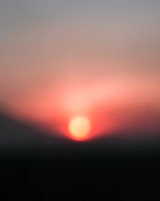 A soft-focus image of a sunrise symbolizing new beginnings and anticipation.