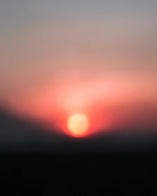 A soft-focus image of a sunrise symbolizing new beginnings and anticipation.