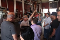 A group of engineers discussing plans in a green energy facility.