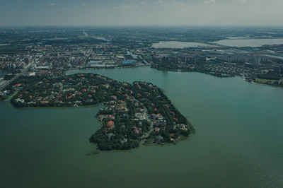 Aerial shot of La Unión island highlighting the orderly layout of lots and nearby natural landscape.