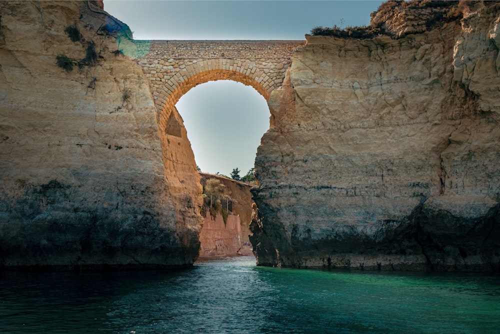 brown rock formation on sea during daytime