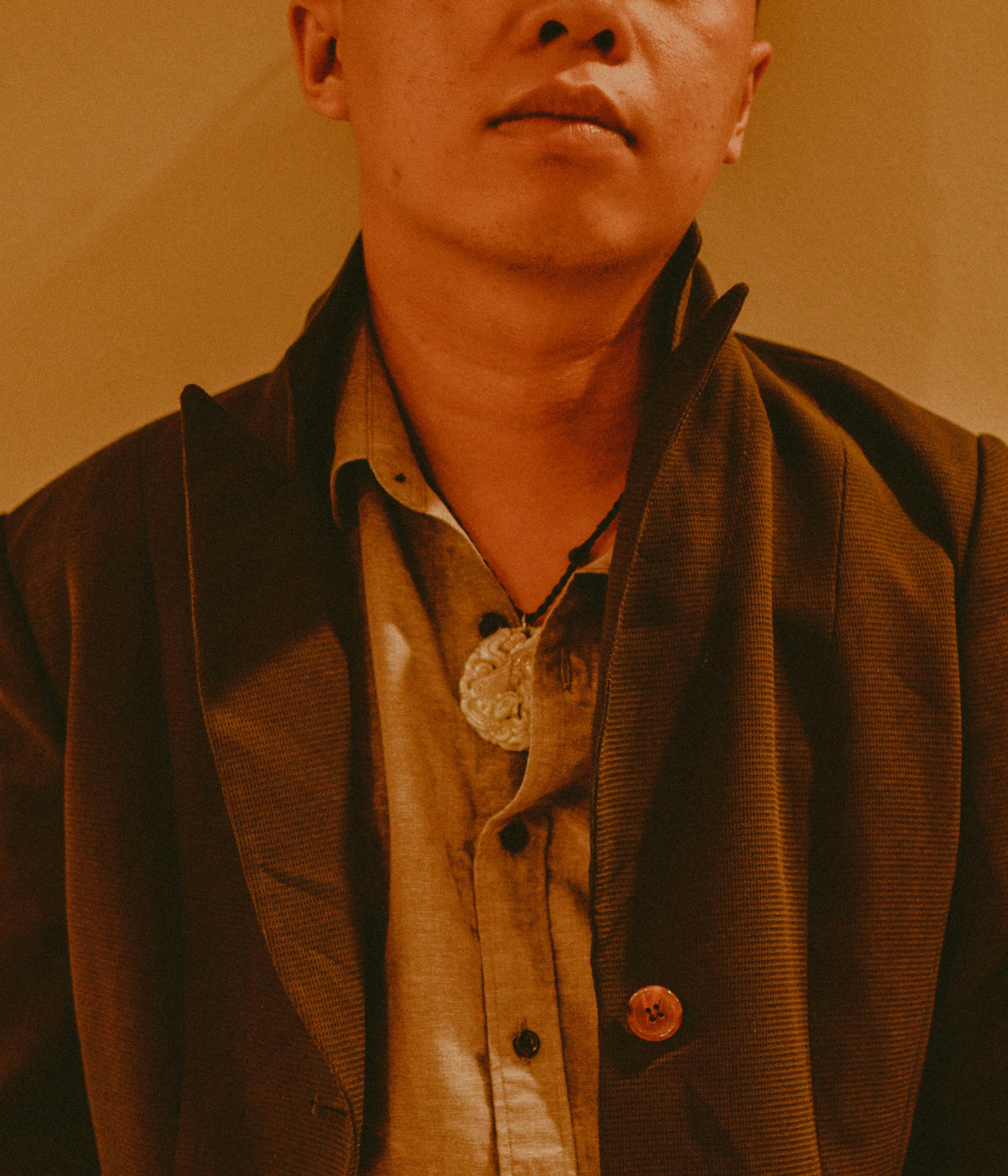 man in brown button up shirt