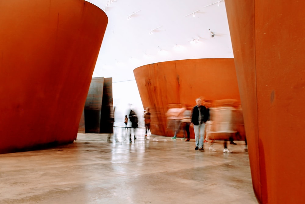 people walking on white floor tiles